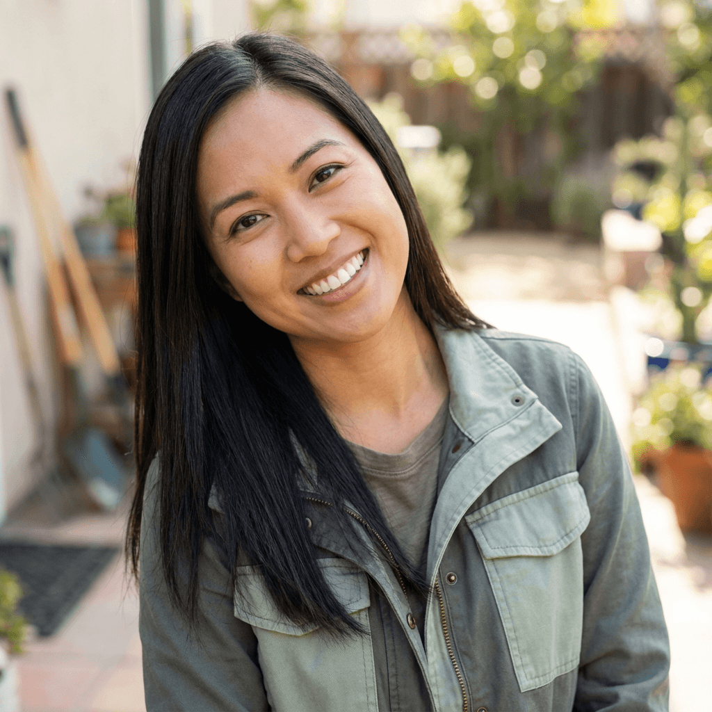 Female homeowner in her late 40s, East Asian, warm and friendly appearance suitable for residential setting